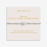Joma Jewellery Sending Love And Sympathy bracelet presented on a blush pink sentiment card