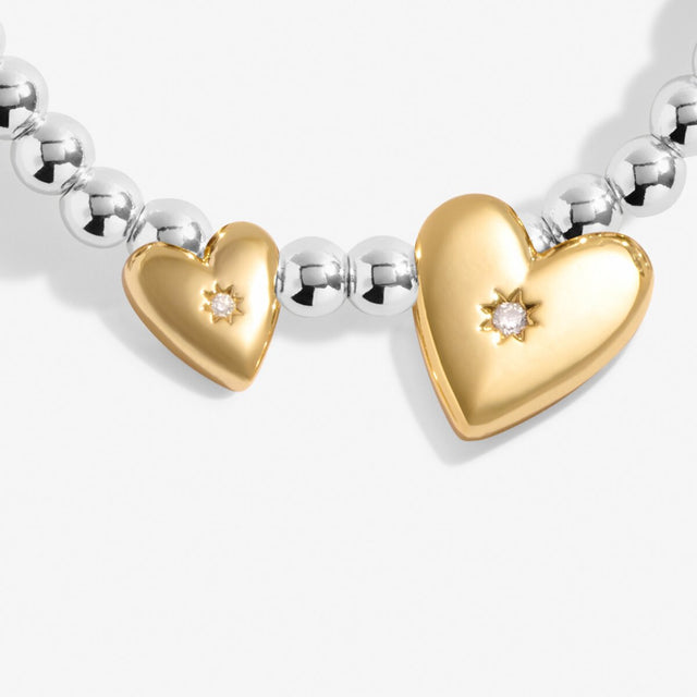 Gold heart charm detail on Super Sister bracelet