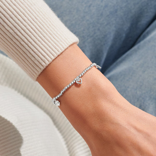 Joma Jewellery With Love silver charm bracelet worn on wrist