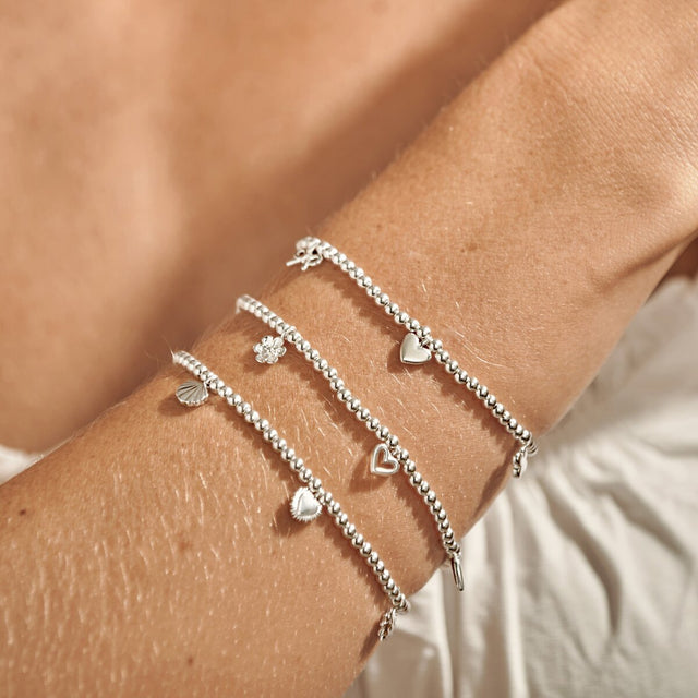 Wonderful Mum silver charm bracelet styled in layered bracelet stack