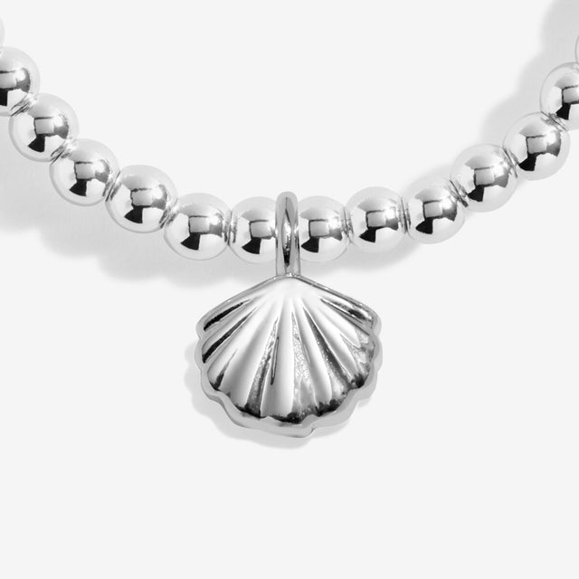 Shell charm detail on Joma Jewellery charm bracelet