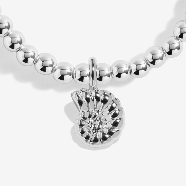 Shell charm detail on Joma Jewellery charm bracelet