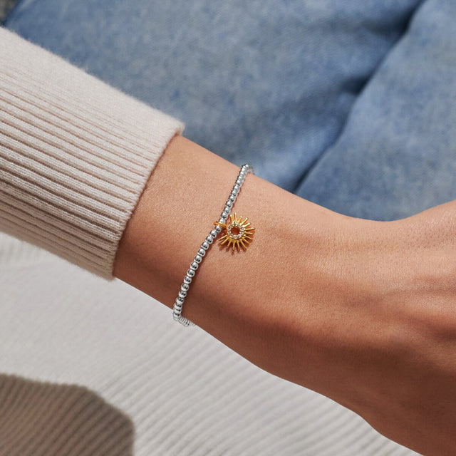 Joma A Little You Brighten My Day silver and gold bracelet worn on wrist