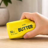 Jumbo Butter Squishy 23cm being squeezed in hand for stress relief, anxiety reduction and sensory play