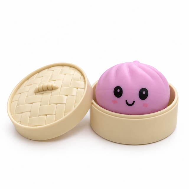 Pink Kawaii Squeezy Dumpling squishy toy in an open cream basket