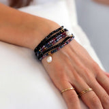 Obsidian Dream crystal jewellery wrap worn as layered bracelet.