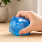 Large Ice Cube Squishy Fidget Toy being squeezed in hand for stress relief, anxiety reduction and sensory play