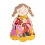 Close up of Lucky Little Ladies Special enamel pin badge keepsake gift with colourful floral design.