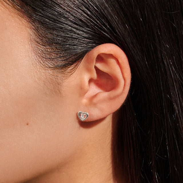 Silver heart mum jewellery stud earrings worn on ear