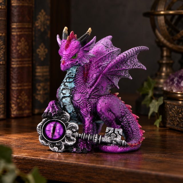 Nemesis Now Keeper of the Key Purple Dragon Figurine — 9.5cm displayed in a dark gothic setting