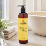 Orange Blossom Honey hand and body lotion displayed beside a bathroom basin