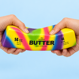 Rainbow butter large 23cm slow-rise squishy toy being squeezed