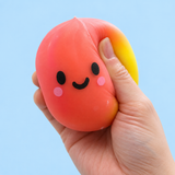 Rainbow Dumpling sensory squishy toy being squeezed