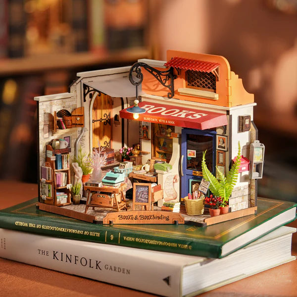 Robotime Rolife kits bookstore miniature close-up with bookshelves, desk and vintage décor details