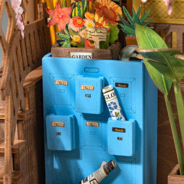 Garden house miniature book nook with flowers and lighting