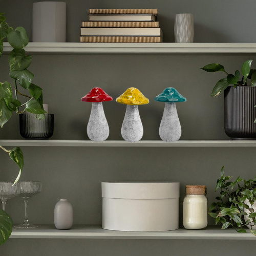 Set of porcelain decorative mushrooms styled on a shelf, adding natural charm to modern and rustic interiors.