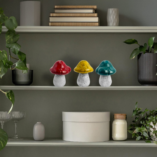 Set of porcelain decorative mushrooms styled on a shelf, adding natural charm to modern and rustic interiors.