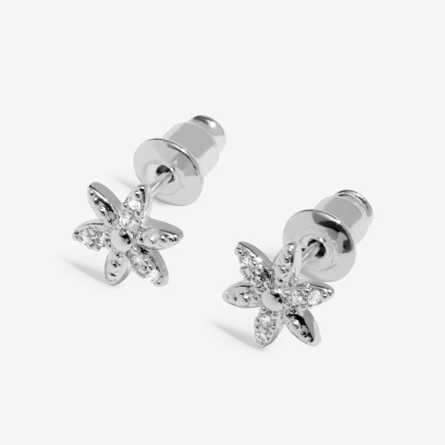 Silver flower earrings angled view