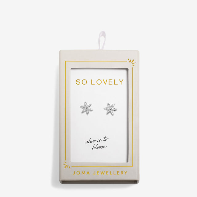Silver flower earrings displayed on gift card