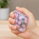 Snowflake Cube squishy fidget toy being squeezed in hand for stress relief, anxiety reduction and improved focus