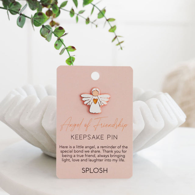 Splosh Angel of Friendship Keepsake Pin displayed upright beside its pink backing card with angel motif and quote.