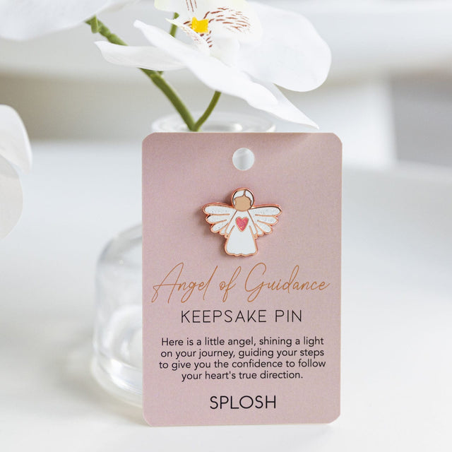Splosh Angel of Guidance Keepsake Pin displayed upright on card with soft floral styling and warm background.