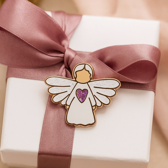 Splosh Angel of Prayer pin tied to a pink gift box with ribbon, perfect for thoughtful gifting occasions.