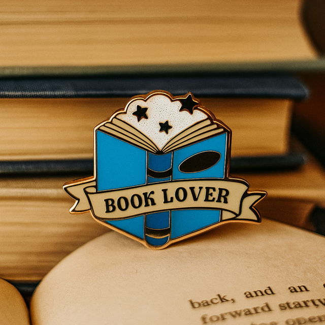 Splosh Book Lover enamel pin styled on stack of open books