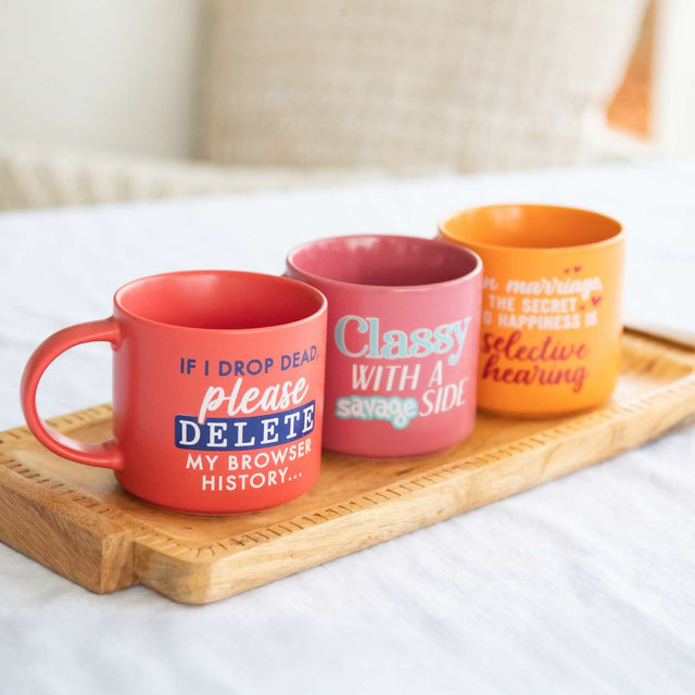 Splosh Cheeky Mug Classy Savage displayed with other witty mugs on wooden tray – funny coffee mugs for her, novelty kitchenware gift.