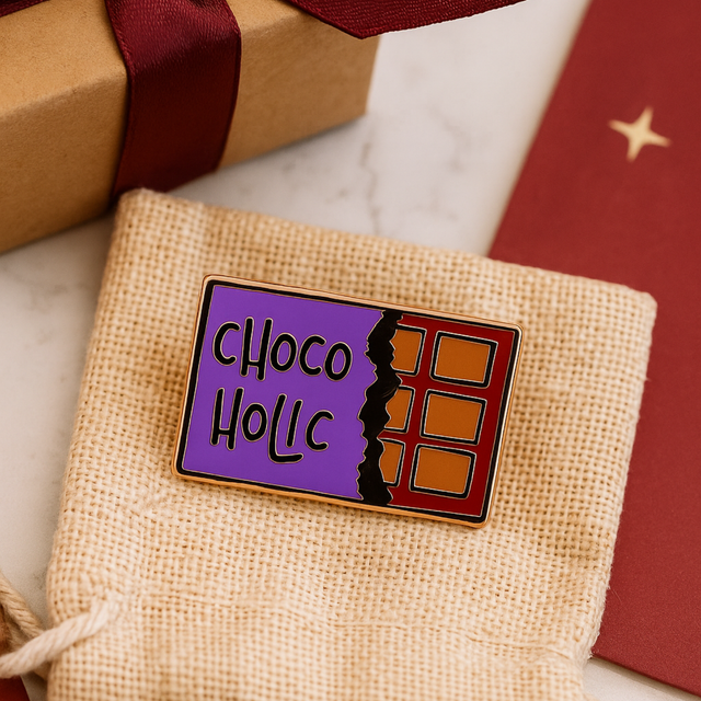 Chocolate Lover enamel pin presented on gift box with ribbon and stars