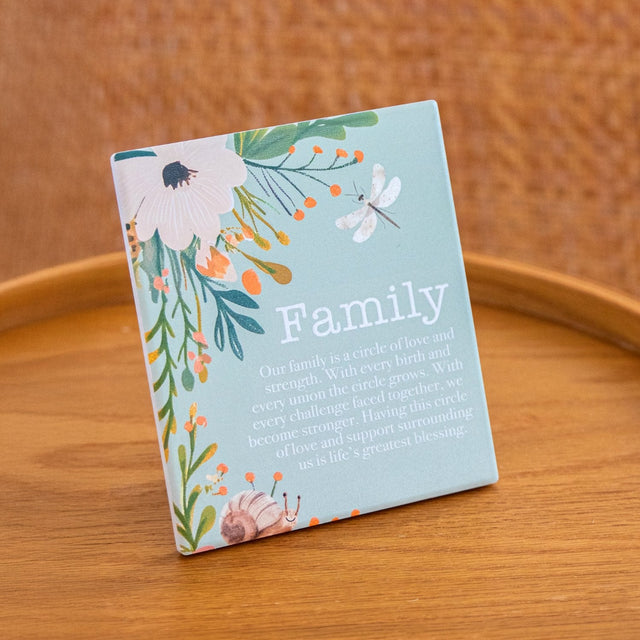 Splosh Cottage Grove Family Verse decorative ceramic plaque displayed on table with other verses in collection