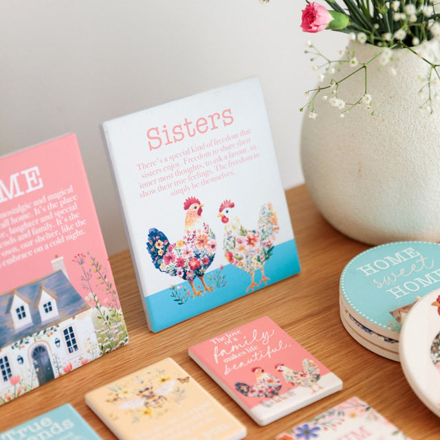 Splosh Cottage Grove Sister Verse decorative ceramic plaque displayed on table with other verses in collection