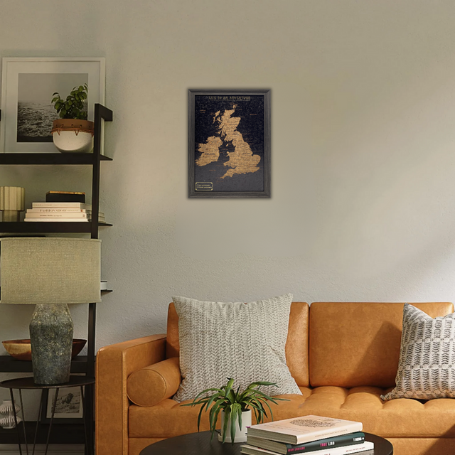 Splosh framed UK and Ireland travel map displayed above a sofa