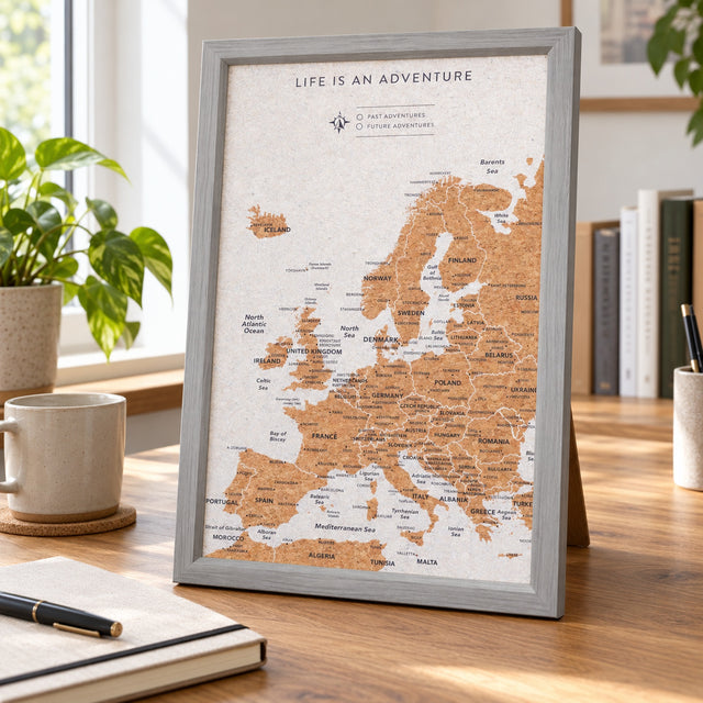 Splosh grey Europe travel map with grey woodgrain frame, XL Desk map standing on a home-office desk