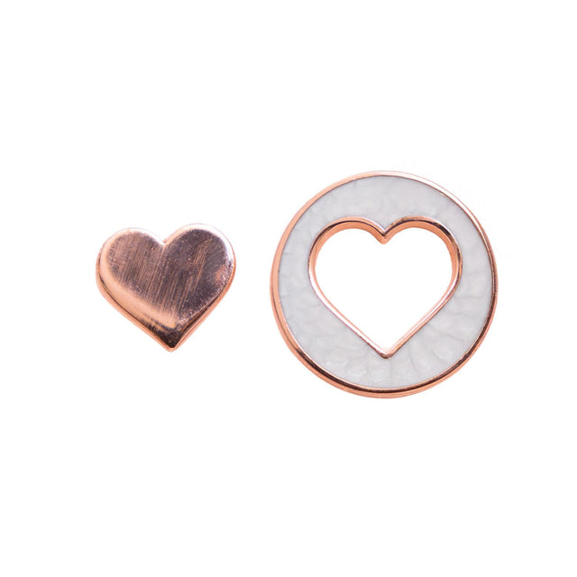 Close-up of Splosh two-part Heart Keepsake Pins in rose gold and white