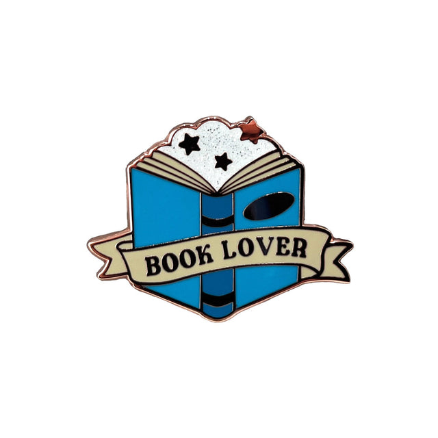 Close-up of Splosh Book Lover enamel pin shaped like an open book