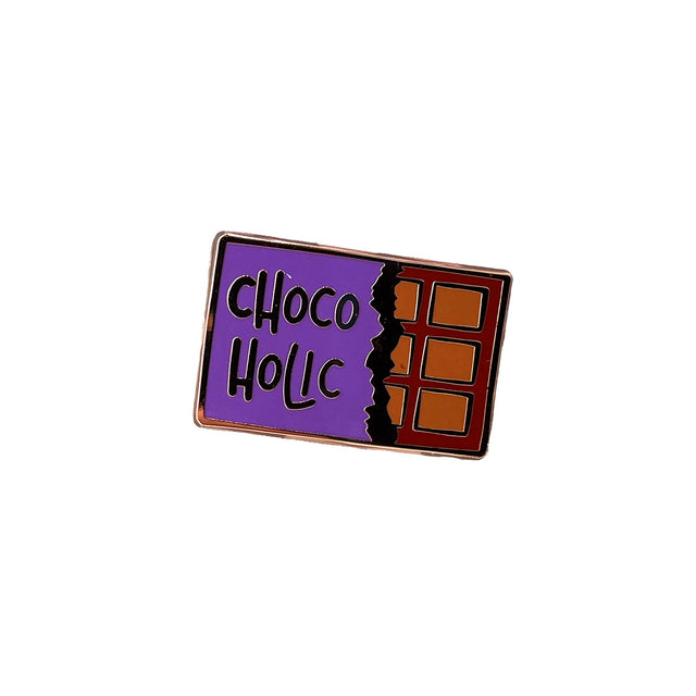 Close-up of Splosh Chocolate Lover enamel pin shaped like a chocolate block