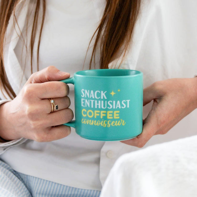 Splosh Snack Coffee Mug in use – funny turquoise mug for coffee and snack lovers, perfect gift for work or home.