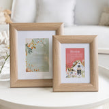 Wooden frame for photos displayed on wooden side table with home & family text detail