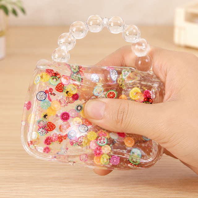 Transparent handbag squishy toy with soft stretchy gel and fruit slice filling