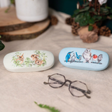 Wrendale Designs Pottering About bird glasses case protecting sunglasses on table with another glasses case in the range