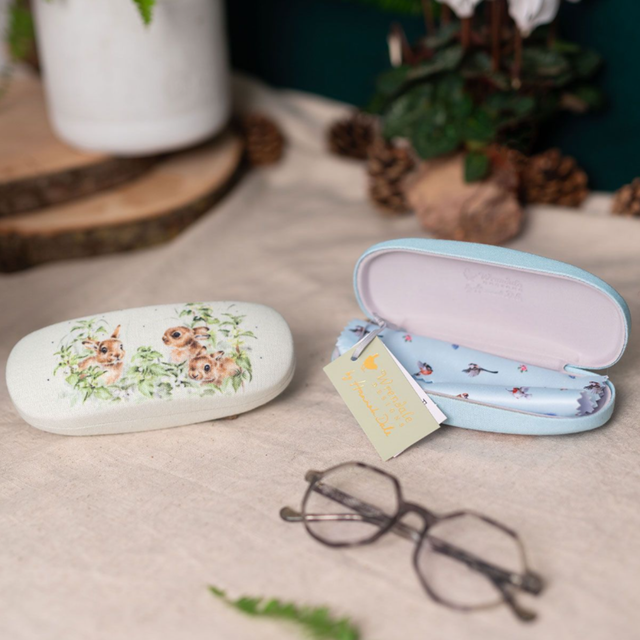 Wrendale Designs Spring Hares glasses case protecting sunglasses on table with another glasses case in the range