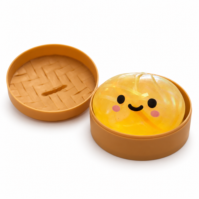 Yellow dumpling squishy toy displayed in an open brown basket