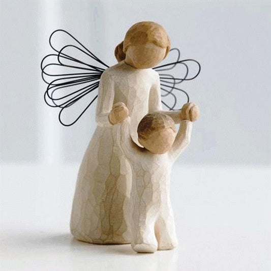 Willow Tree Guardian Angel figurine. This beautiful hand carved figurine depicts an angel holding up a young child, symbolising that somebody is always watching over you.