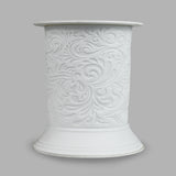 The porcelain material of this Finesse Wax Burner allows bright light to shine through it, providing the opportunity to create this gorgeous design. This is done by crafting images out of thicker and thinner sections of the porcelain, allowing for detailed shadowing and a 3D effect. The porcelains elegant look will fit perfectly in any room is available in a range of designs and two different shapes.