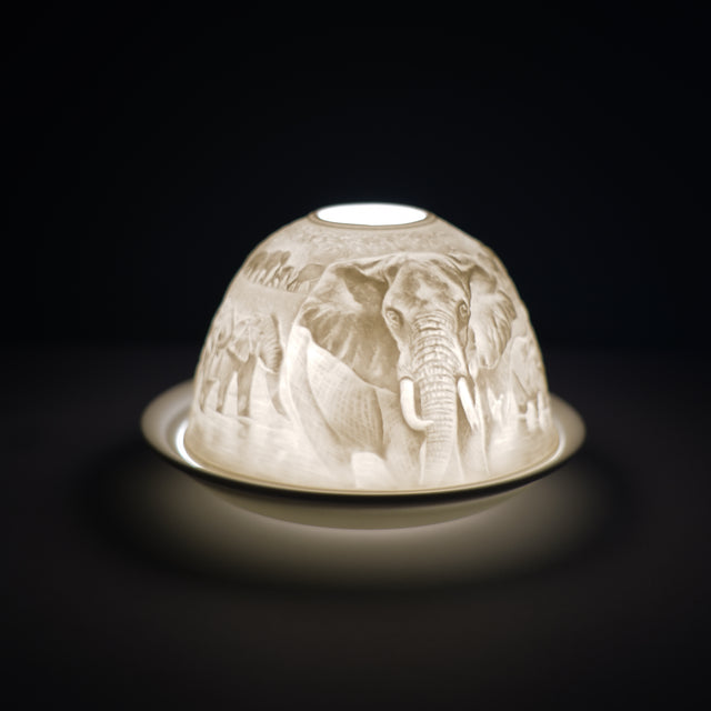 Cello porcelain tealight holder dome, in our African plains design. This design displays elephants in their natural environment on the African plains. We offer a wide range of porcelain tealight holders to let you choose your show stopping piece and show it off with pride when guests and family are over. Pick your preferred option between LED lights or using tealight candles. 