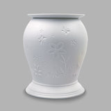 The porcelain material on this Wax Melt Burner allows bright light to shine through it, providing the opportunity to create this Flower design. This is done by crafting images out of thicker and thinner sections of the porcelain, allowing for detailed shadowing and a 3D effect. The porcelains elegant look will fit perfectly in any room is available in a range of designs and two different shapes.