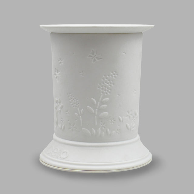 The porcelain material of this Floral Wax Burner allows bright light to shine through it, providing the opportunity to create this gorgeous design. This is done by crafting images out of thicker and thinner sections of the porcelain, allowing for detailed shadowing and a 3D effect. The porcelains elegant look will fit perfectly in any room is available in a range of designs and two different shapes.