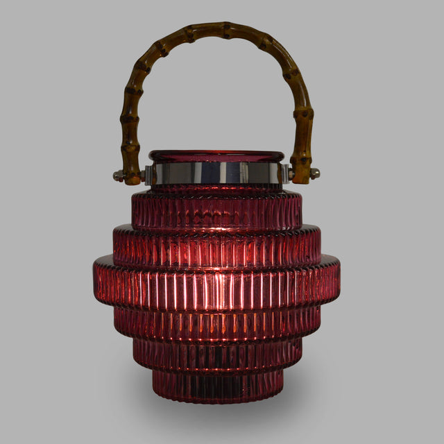 A unique style of lamp that catches your eye with its beautiful glass pattern emphasizing its stacked shape, and its dark red colouring.