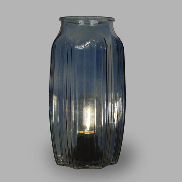 This peaceful large blue lamp with lined glass detailing and a beautiful round ovoid shape creating a elegant and classy look  